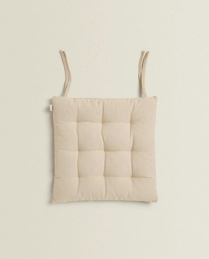 QUILTED CHAIR CUSHION WITH TIES